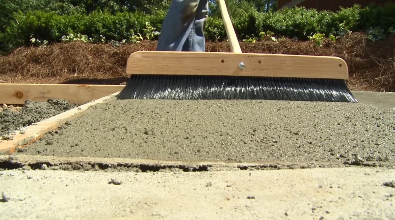 Durable concrete sidewalk with broom finish technique